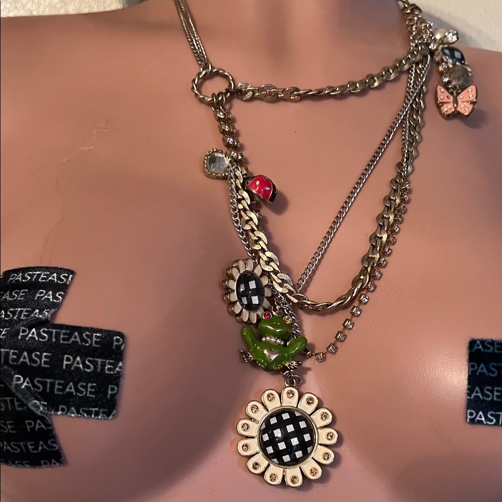 Gold-Tone Layered Necklace with Black & White Flower and Green Frog Charm